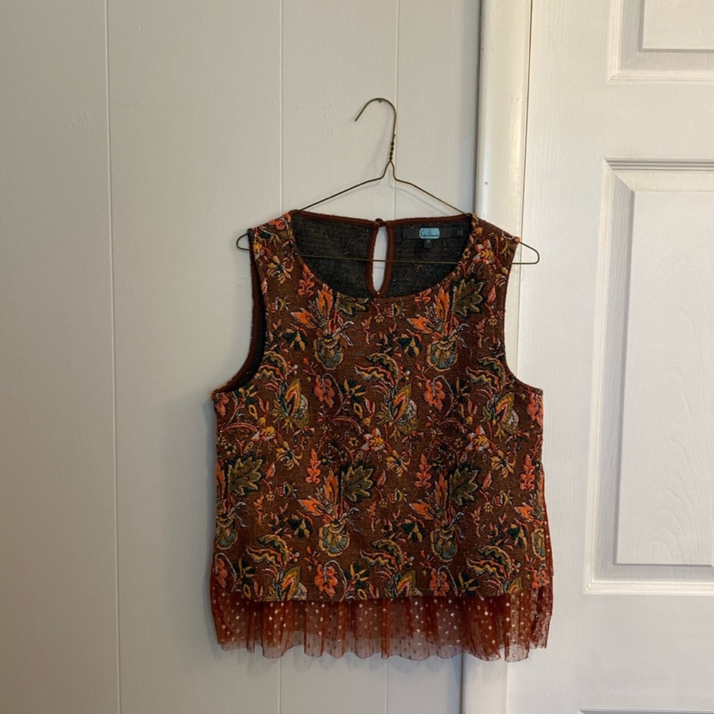 This is an Anthropologie shirt, with a cute peplum style fringe at the bottom